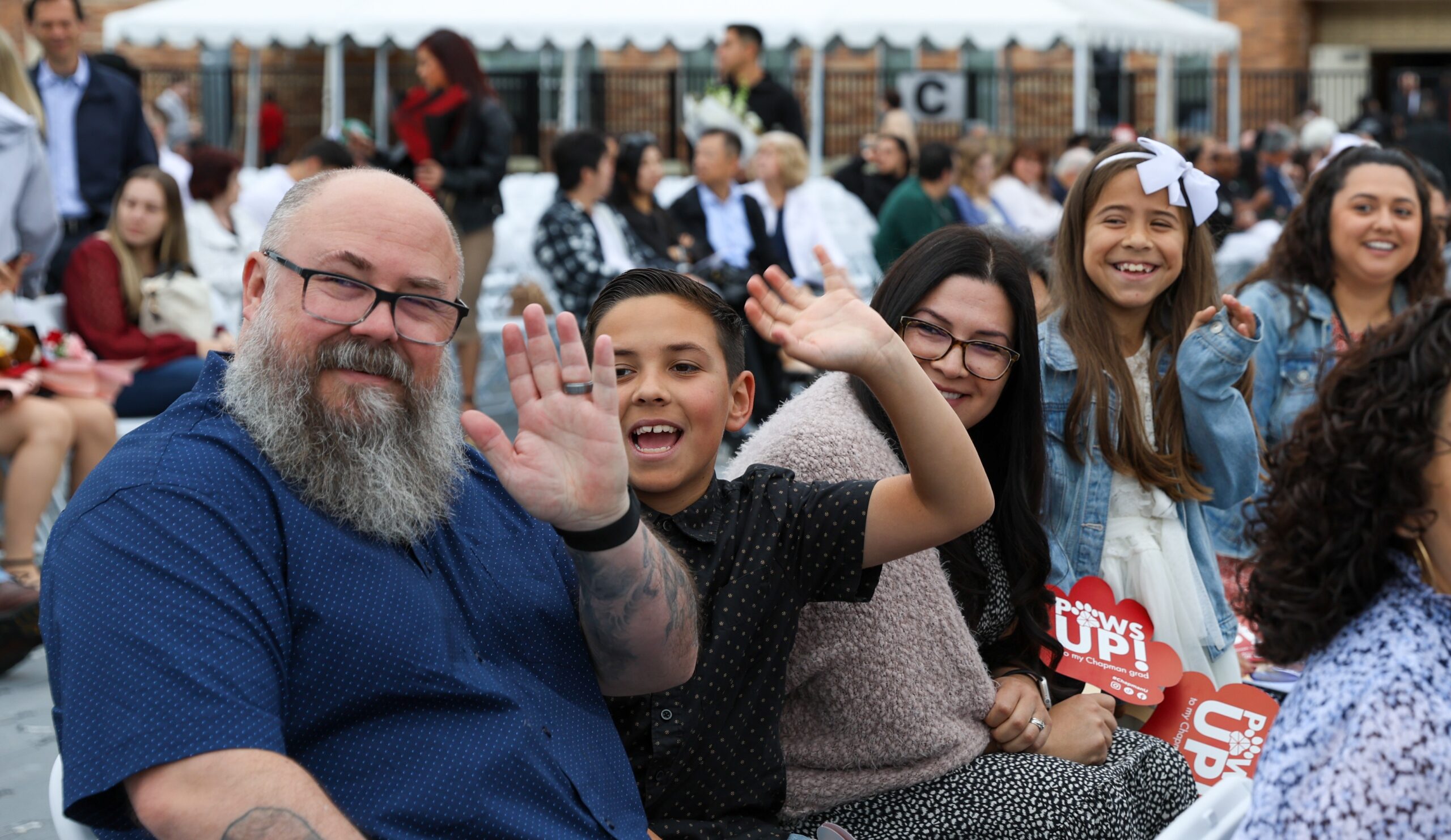 Family members waving.